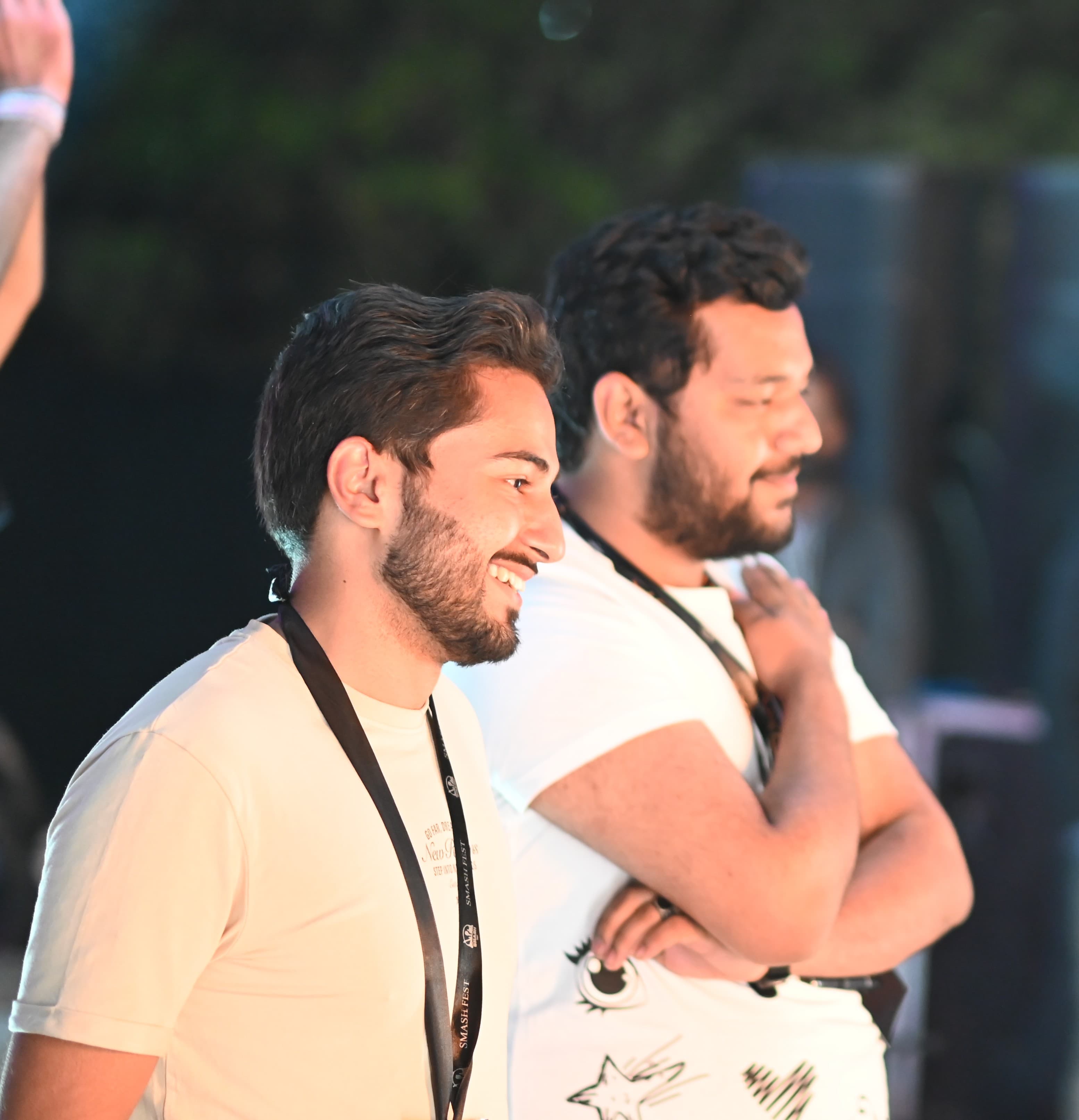 Crew members laughing together between sets at SMASH FEST Season 1