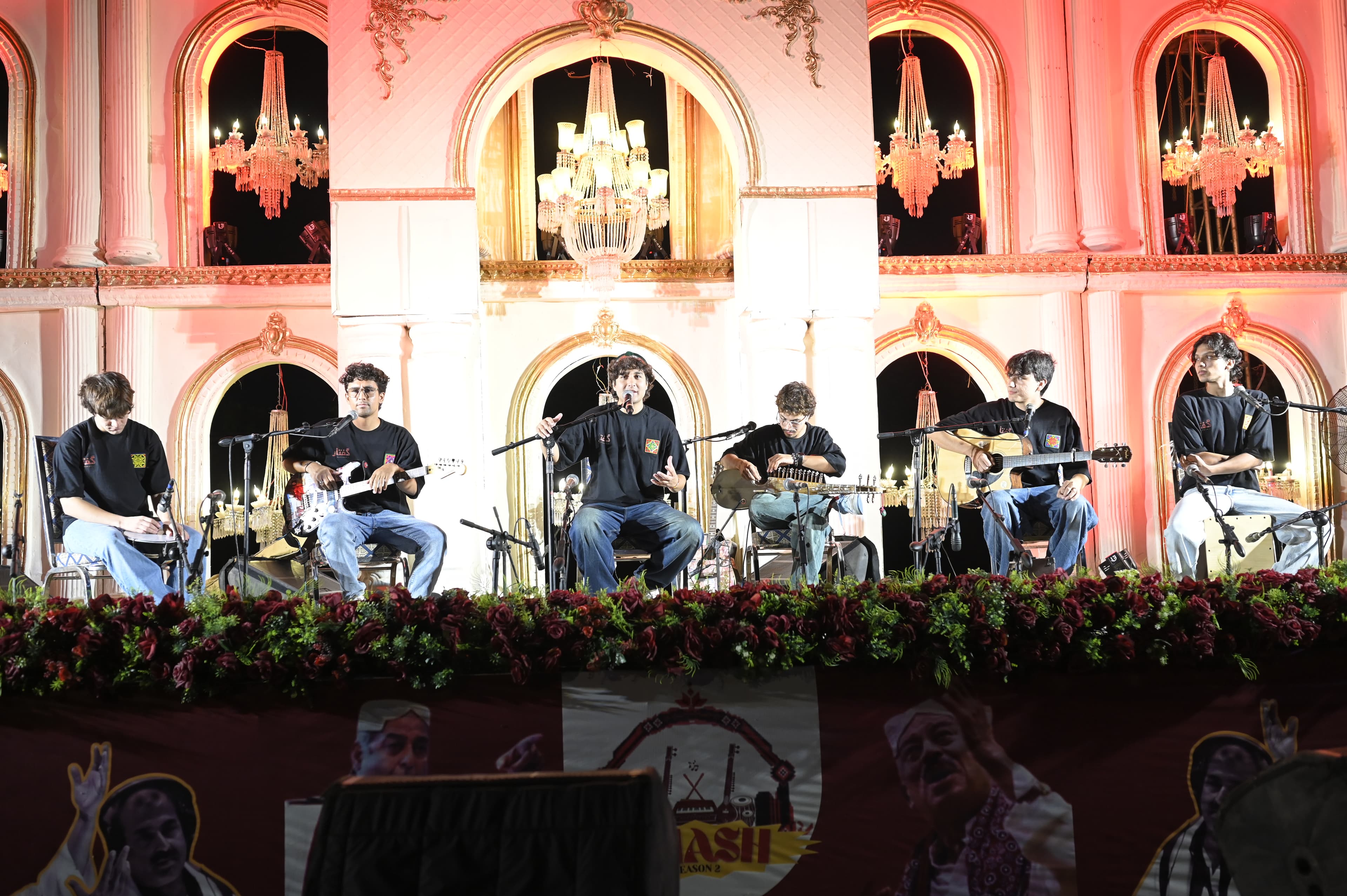 A six-piece band performing together on an ornate balcony stage at SMASH FEST Season 2